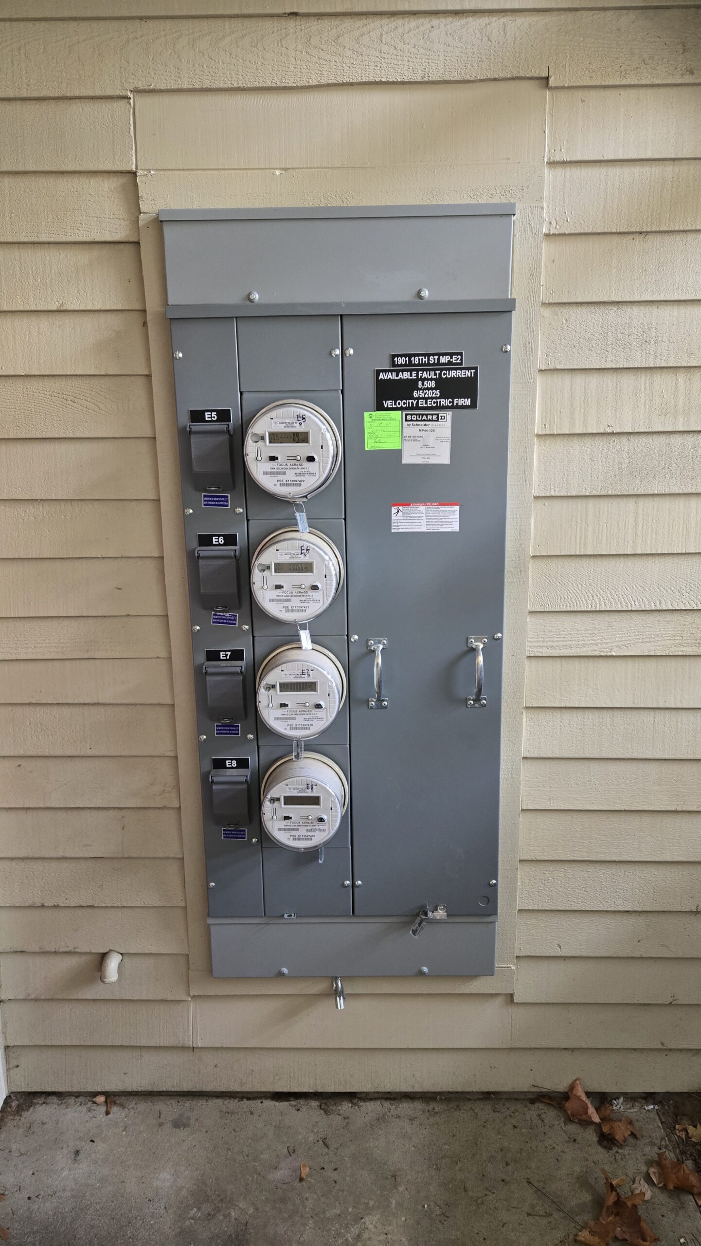 Replacement four-gang meter pack installed by VECOR during the multifamily electrical upgrade.