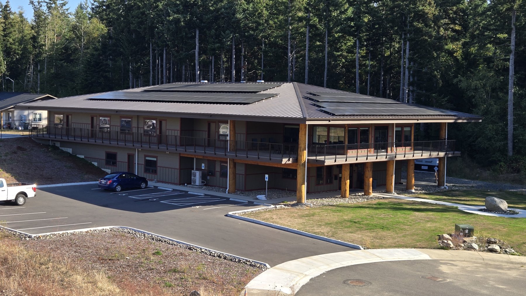 lummi-elder-care-center Lummi Elder Care Center viewed from the parking area, showing solar modules across the roof.